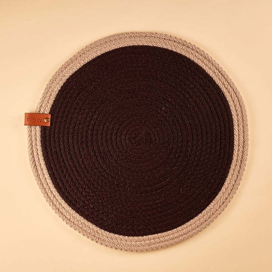 Round fabric placemat with a dark center and beige border.