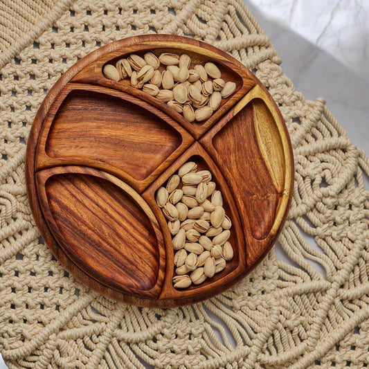 Wooden divided snack platter with beans on a macrame placemat.