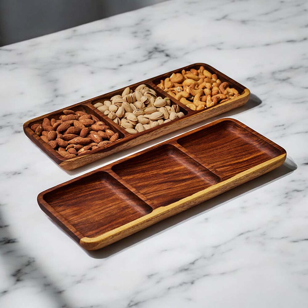 Wooden tray filled with nuts on a marble countertop.